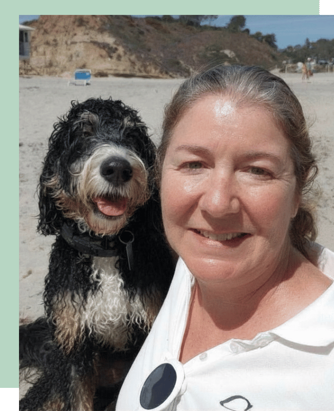 Gina and Ollie on the beach in Encinitas during a pet sitting and dog walking visit